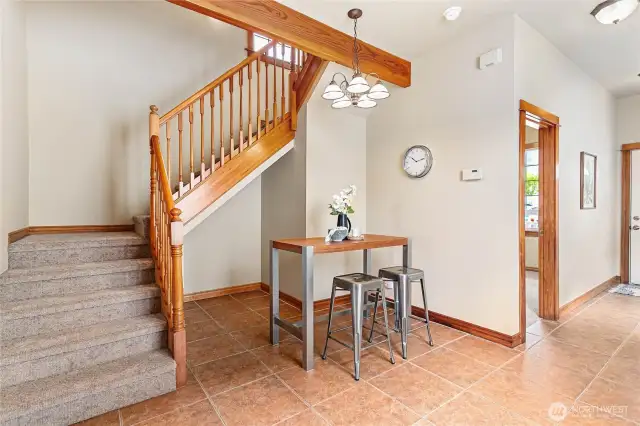 Staircase leading to the upstairs which offers two additional bedrooms and a full bathroom.