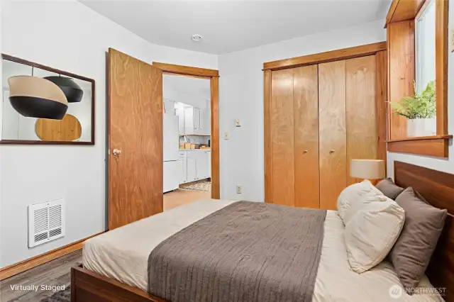 Comfortable ADU bedroom featuring generous closet space and a soothing neutral color palette.