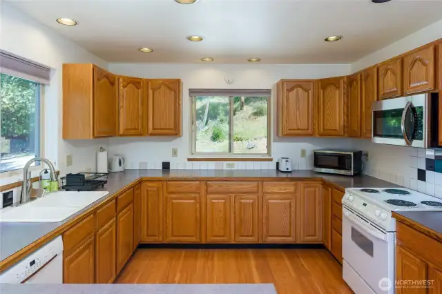Generously sized kitchen with ample counter space, perfect for cooking, hosting, and everyday living