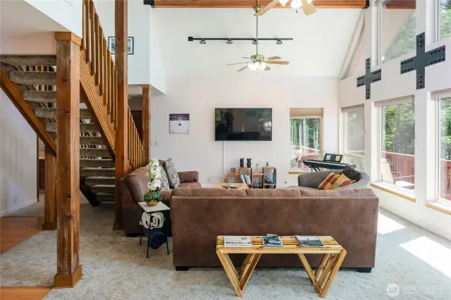 Clean lines, cathedral ceilings, a wall of windows bringing the outdoors in, open concept, and natural wood touches. PNW Contemporary living
