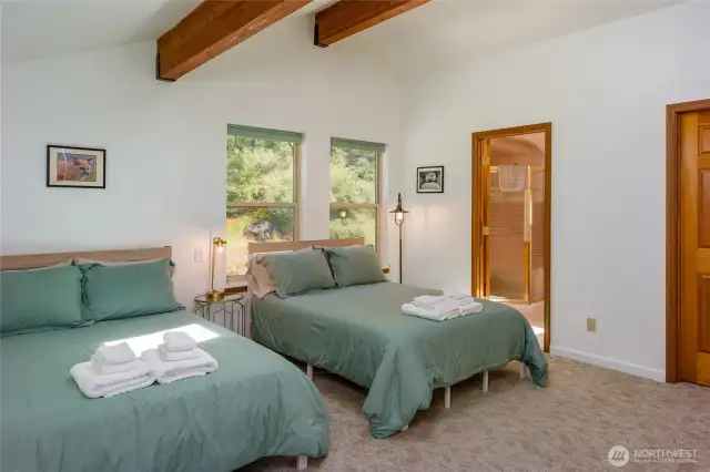 Primary bedroom with ensuite bathroom and walk-in closet