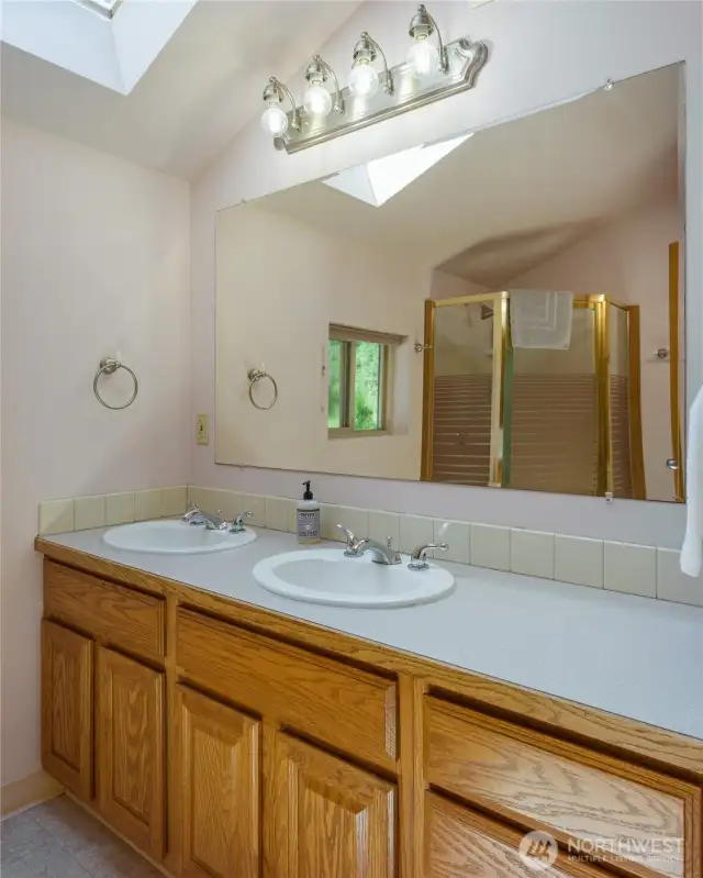 Primary bedroom ensuite bath with skylight allows the natural light to flood in