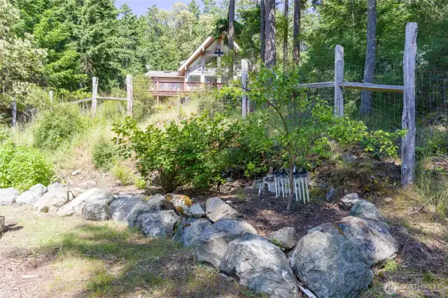 A six zone drip irrigation system is installed with room and piping to expand into future beds. The system is controlled by a Rachio smart controller. That allows app based remote monitoring and scheduling and automatically adjusts to changing weather patterns and times of the year. Gardening made easy!