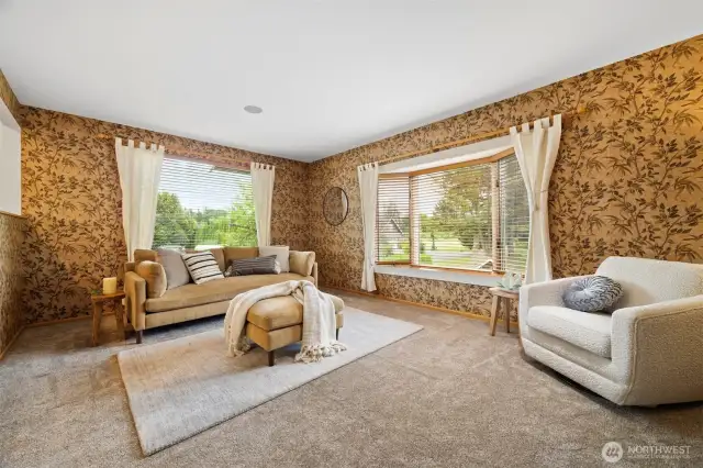 Another view of the living room on the main floor that looks out to the southerly views.