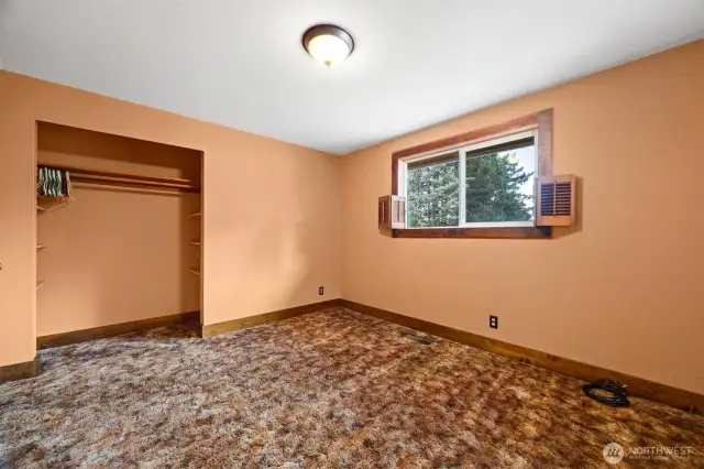 The second bedroom on the main floor looks out to the rear yard and is very spacious.