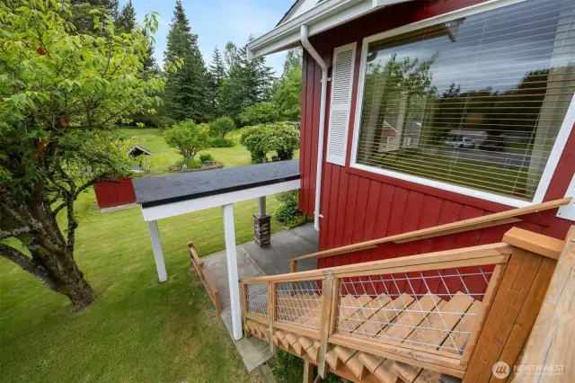 The stairs off the deck lead down to the heated and covered patio.