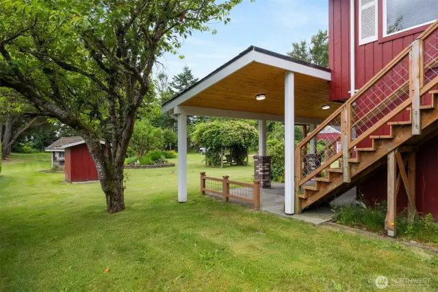 The rear yard is such an oasis and the covered patio is a special spot to take that all in...and when it is chilly, yo can turn on the overhead heaters!