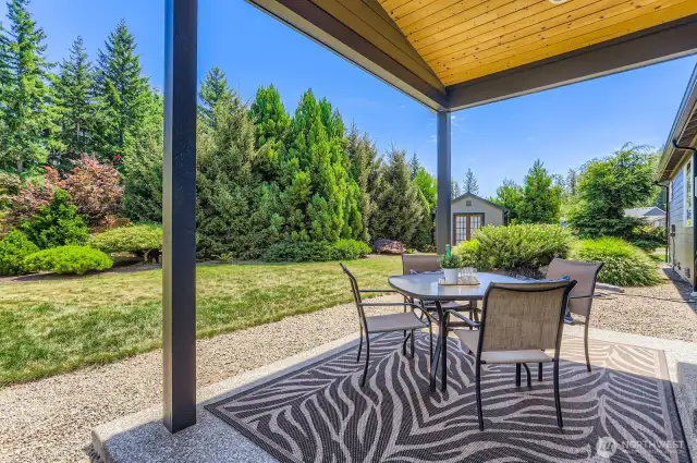 Great covered patio to enjoy the fabulous private yard