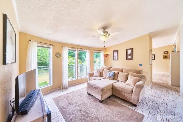 Adjacent great room also has large windows letting in lots of light.