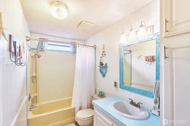 Full bathroom serves the bedrooms on this side of the house.