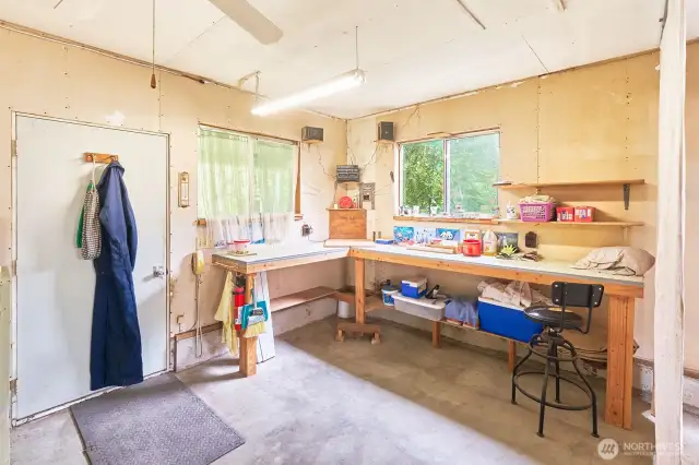 DIY dreams start here—spacious workshop area tucked right inside the garage.