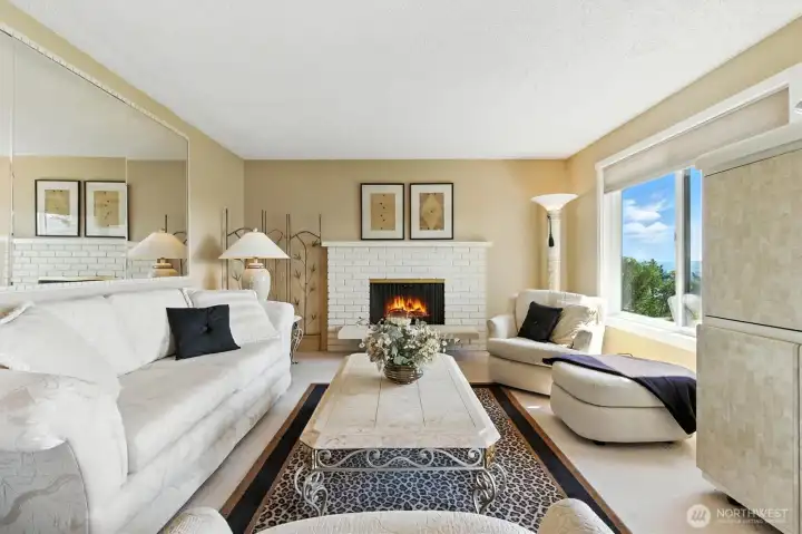 Enjoy beautiful mountain views and the cozy fireplace from the living room.