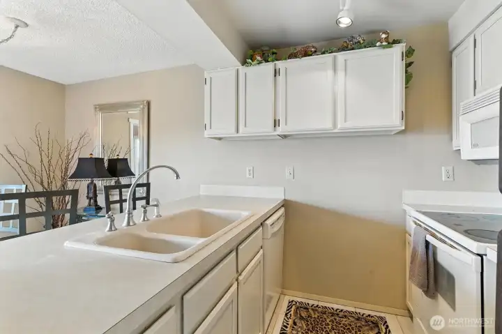 Kitchen offers a breakfast bar for two.