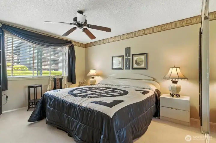 Primary bedroom is spacious, large closet and ceiling fan.