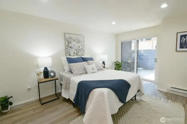Primary bedroom with sliding doors to access your private patio
