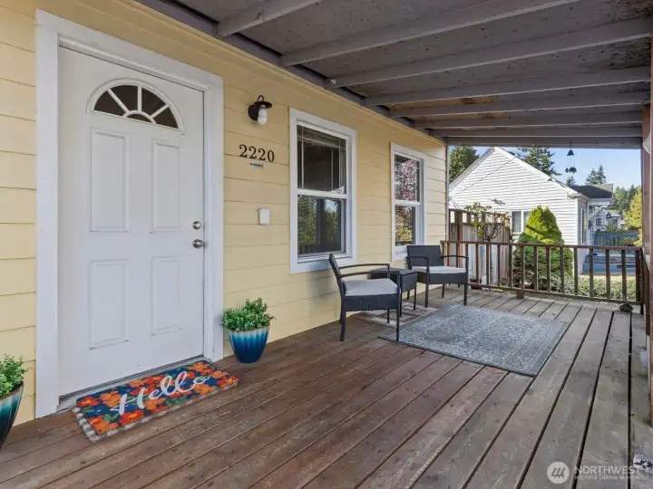 Cute covered front porch is perfect for winding down after a long day.
