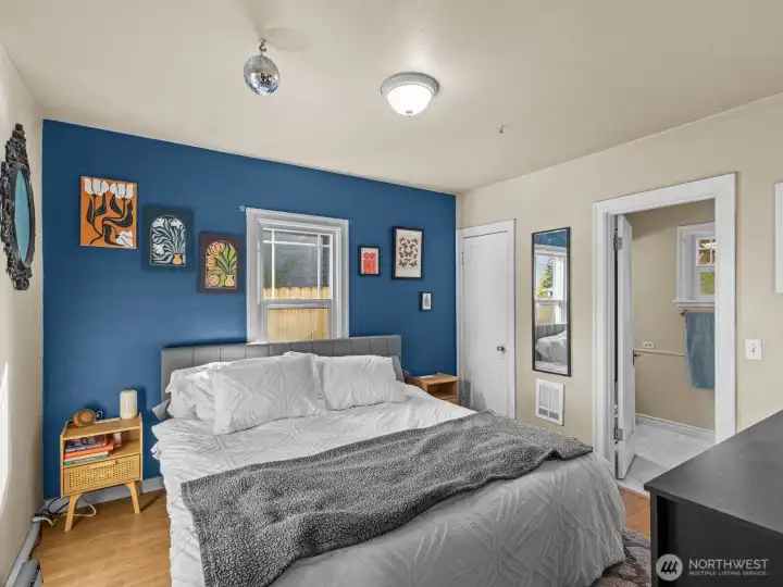 The main floor primary bedroom is immediately to your left and is nice and bright.