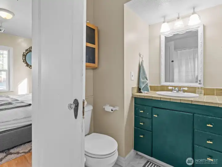 The attached bathroom is a great size and has plenty of space.