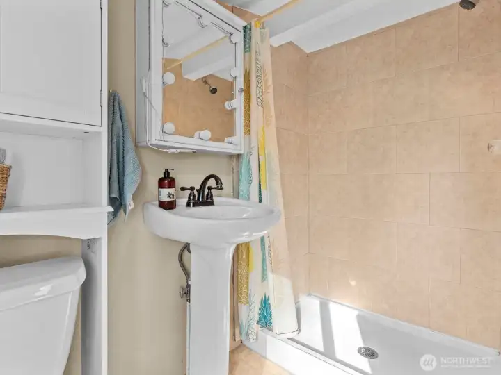 The 3/4 bath is tucked away on the other side and while it's open, it's private as well.