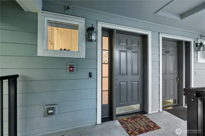 First Unit at the Top of the Staircase.  Offers ideal main floor living and 2nd floor private sleeping /working & laundry spaces