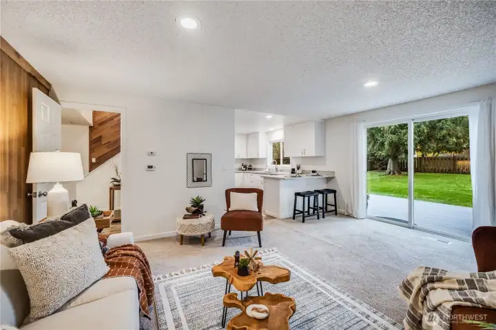 Just off the kitchen is this cozy family room. It steps out easily to the new deck and oversized, level backyard.