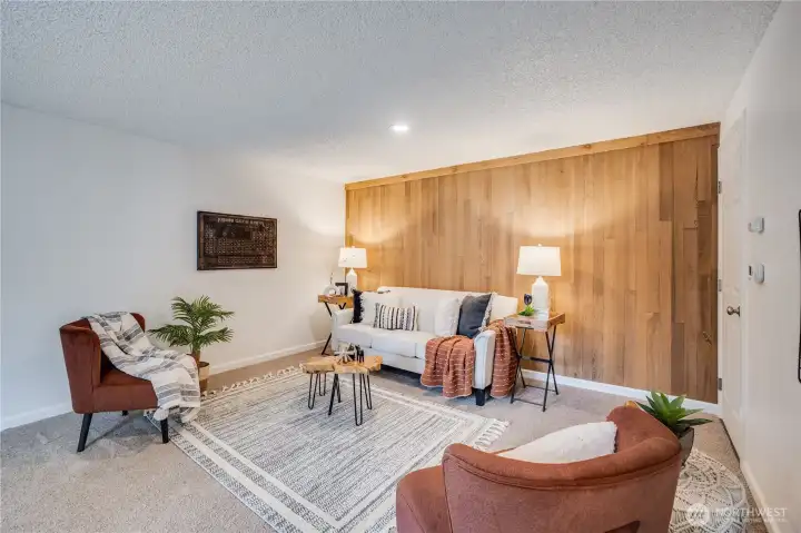 The original, wood lined wall provides a warm accent in this flexible space.