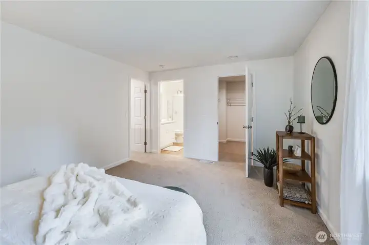A walk-in closet and private bathroom complete the ensuite bedroom.