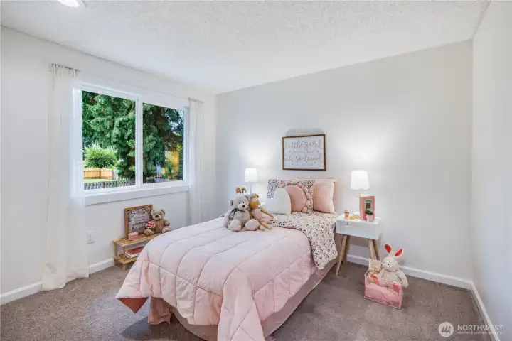 There are two additional bedrooms on the upper level. They both overlook the beautiful backyard.