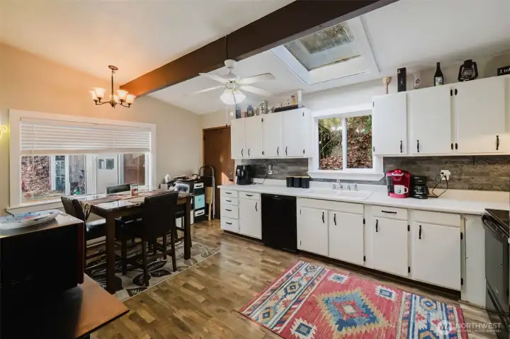 The skylights allow for natural light giving this home added ambience. The large window from the eating area offers viewing of outdoor nature. You won't be disappointed.