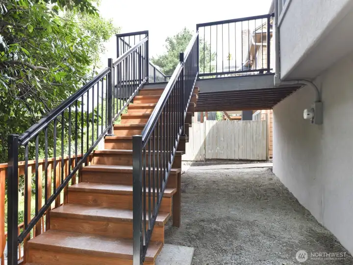 Deck with stairs leading to the back yard.