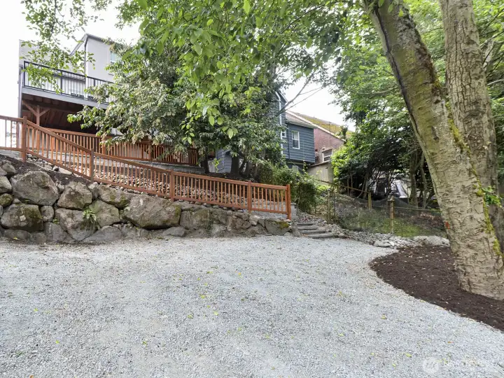 View from the back of the yard looking up to the house. Could be used for extra parking or DADU.