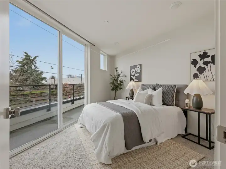 The primary bedroom's slider walks out to the deck - perfect for morning coffee