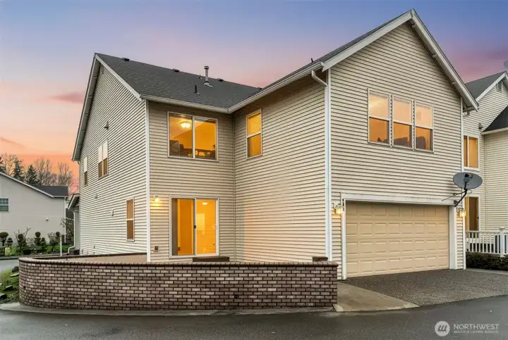 Back and side of home!  2 car garage attached and low maintenance yard