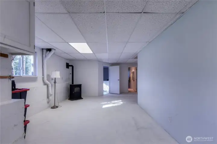 Family room, bonus room w/ pellet stove ~ beverage fridge (not pictured).