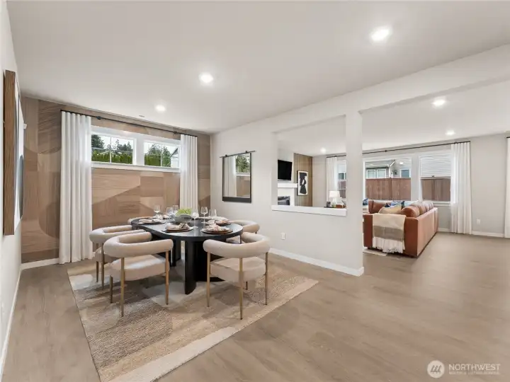 Over-looking at the dining room and family room.  Photo is representational. Actual home is under construction and finishes and colors will vary. See site agent for details.