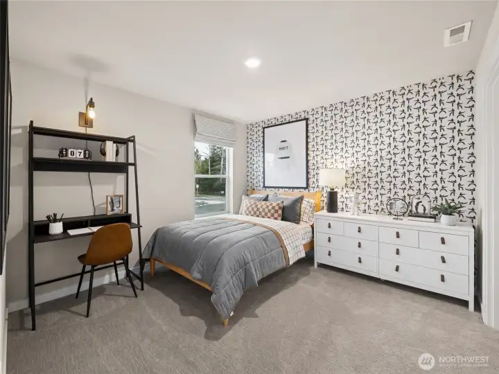 Spacious spare bedroom with walk-in closet. Photo is representational. Actual home is under construction and finishes and colors will vary. See site agent for details.