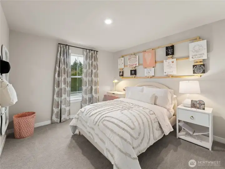 Spacious spare bedroom with walk-in closet. Photo is representational. Actual home is under construction and finishes and colors will vary. See site agent for details.