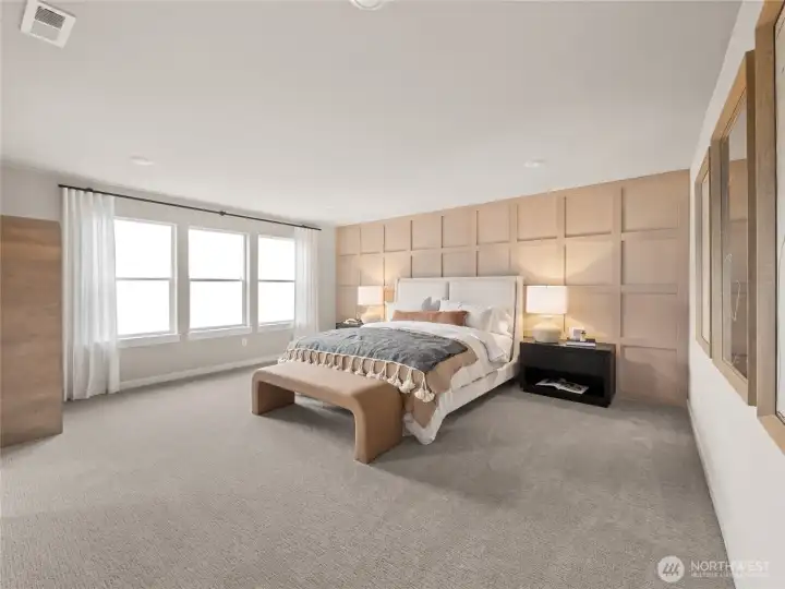 Spacious primary bedroom suite with attached 5-piece bath.  Larges windows to let natural light in.  Photo is representational. Actual home is under construction and finishes and colors will vary. See site agent for details.