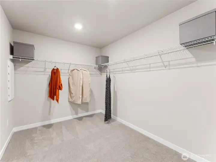 Huge walk-in closet off the primary bedroom. Photo is representational. Actual home is under construction and finishes and colors will vary. See site agent for details.