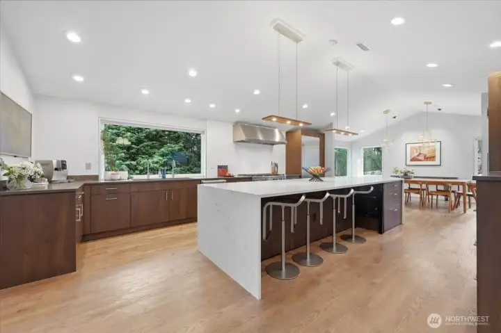 Kitchen a family room and dining room completely remodeled down to the studs in 2022. Walls were upgraded to R-19 insulation, for better building energy efficiency. Miele appliances, including a combi steam oven and a Thermador refrigerator were installed.  Cabinets all walnut with plywood boxes, dovetail drawers.