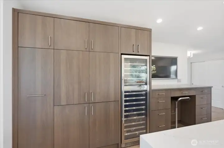 Large wine fridge, appliance garage with 20 amp circuit allowing you to run appliances when needed.  Work station includes Samsung Frame TV with connections to computer, allowing for viewing and following recipes while cooking or for daily work.