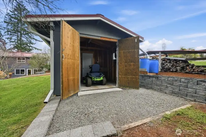 Property includes a Greenworks 80V 42" electric ride-on tractor mower with six batteries, fast charger, and bagger — zero emissions, whisper-quiet, and easily could mow the yard 3 times on a single charge.