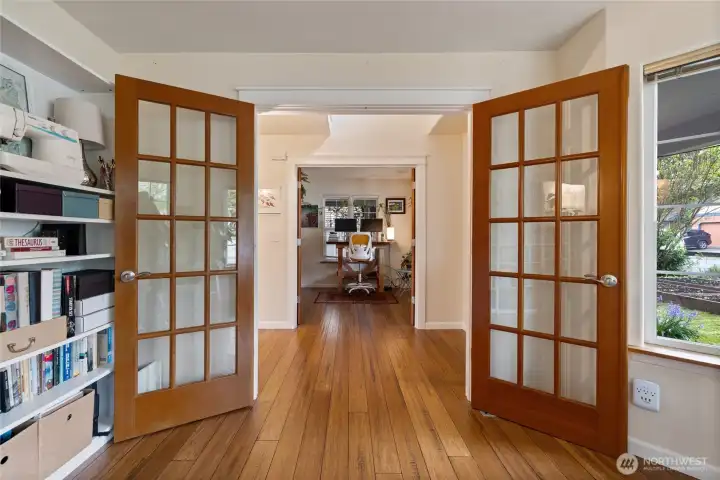 Second set of french doors leads to a den/office space.