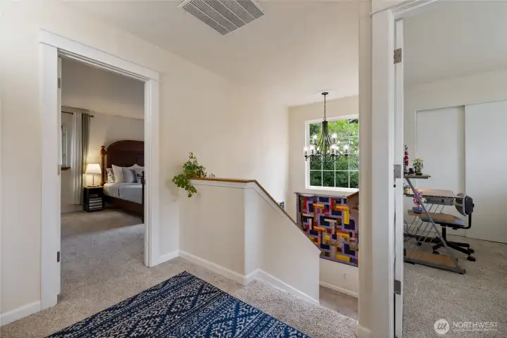 Landing allows flow to multiple rooms.