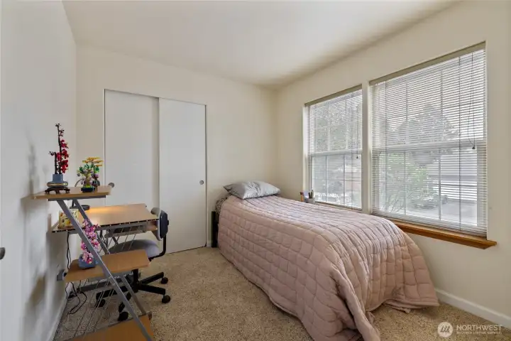 Bedroom #1 overlooks the beautiful front yard.