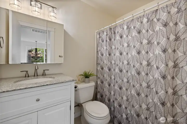 Bright clean main bathroom.
