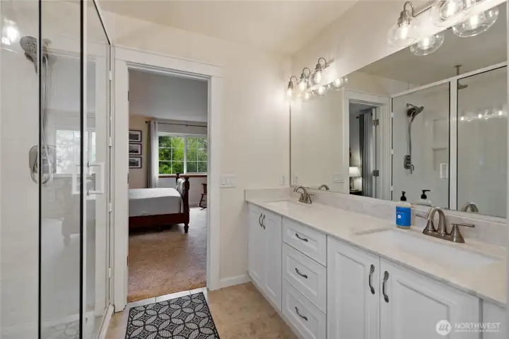 Sparkling double vanity and shower.