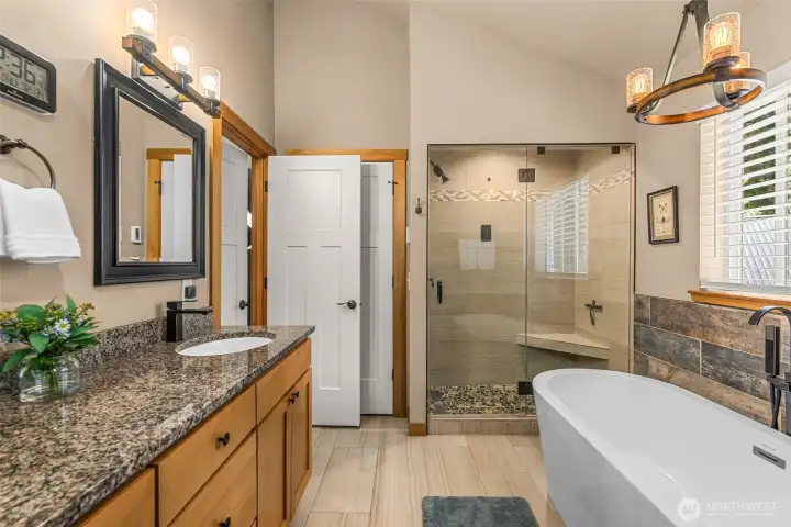Primary bath - Enjoy the comfort of a steam shower, soaking tub, and heated tile flooring.