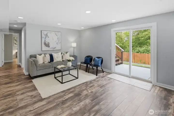 Expansive family room in lower level with backyard access Expansive family room in lower level with backyard access