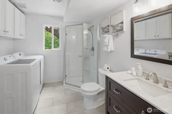 Lower level bathroom with walk-in shower and laundry Lower level bathroom with walk-in shower and laundry